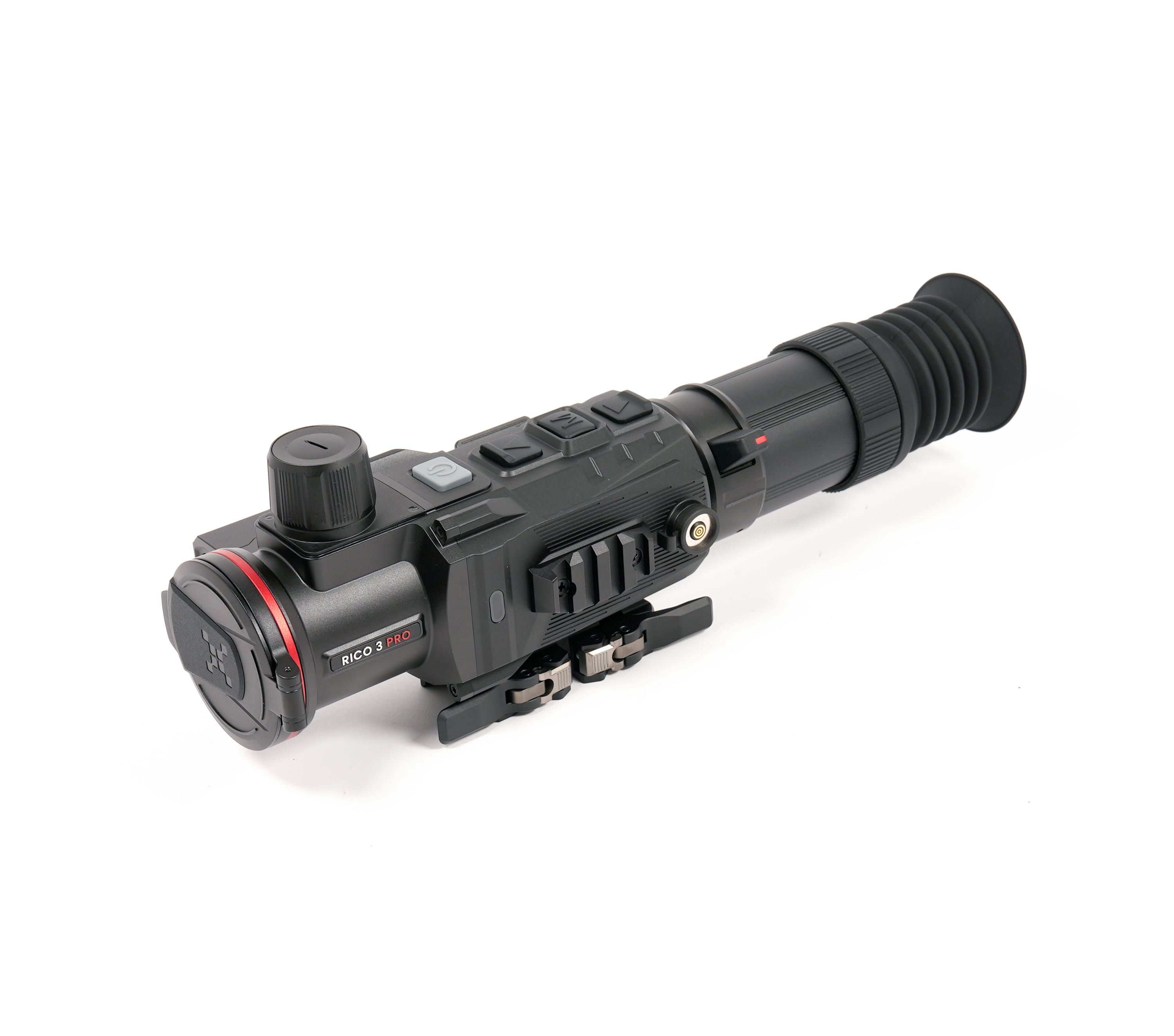 Close-up of a black rifle scope with textured grip and adjustment dials, labeled 'RICO 3 PRO' on the side