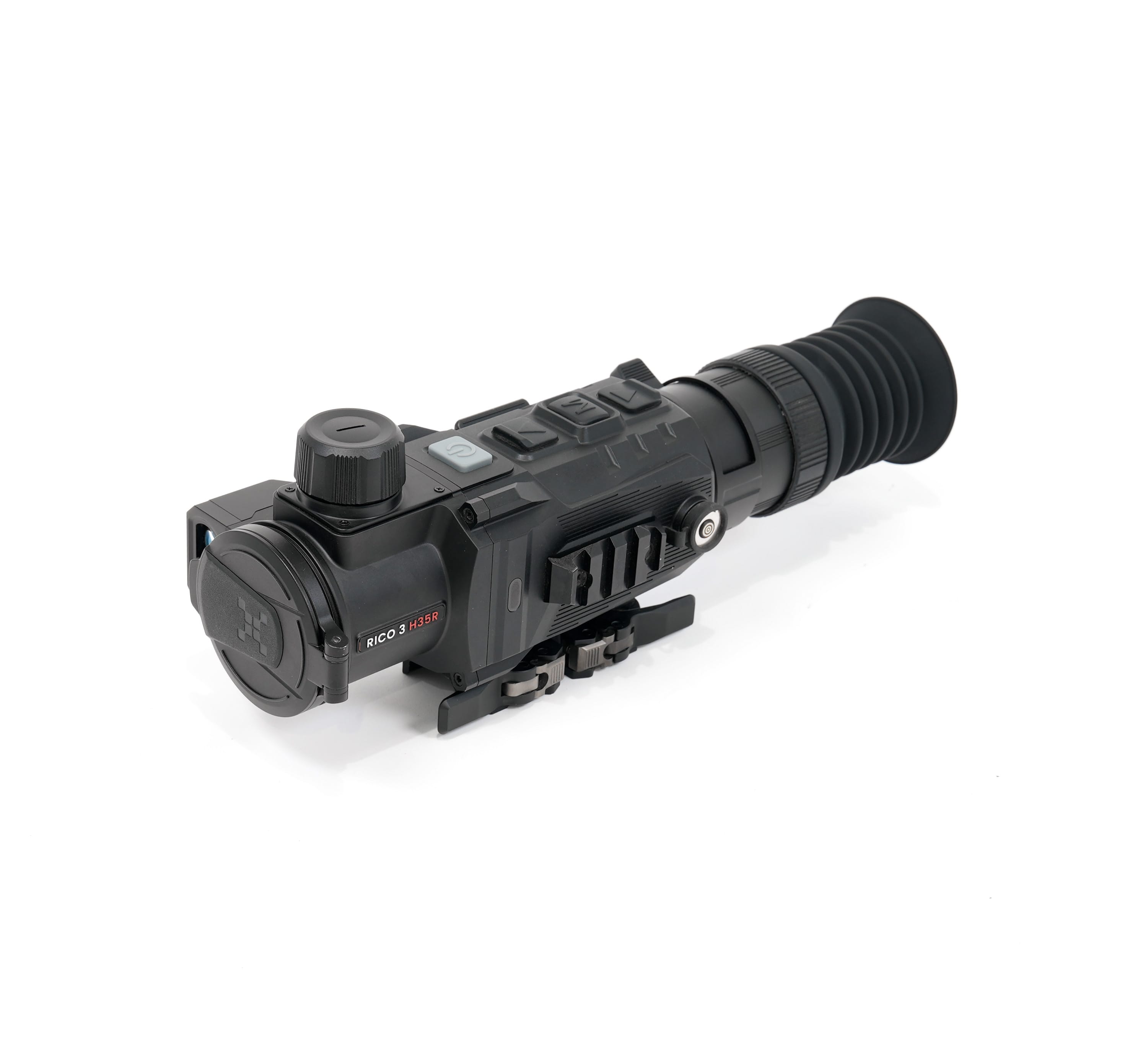 Close-up of a black optical rifle scope with adjustment knobs and a large magnified lens on a white background