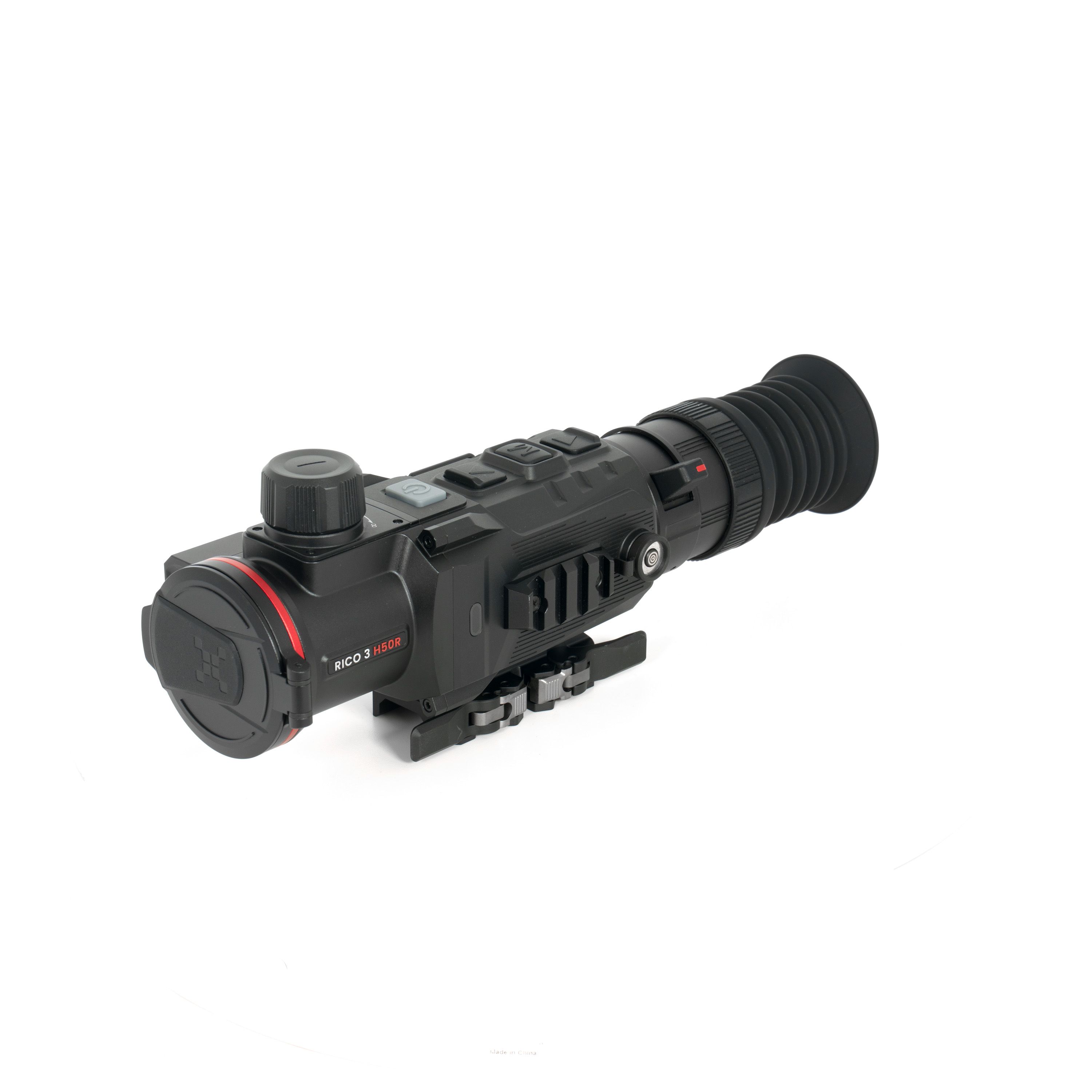 Close-up of a black telephoto camera lens with large zoom ring and textured grip details on the front, showing red accent near the base.