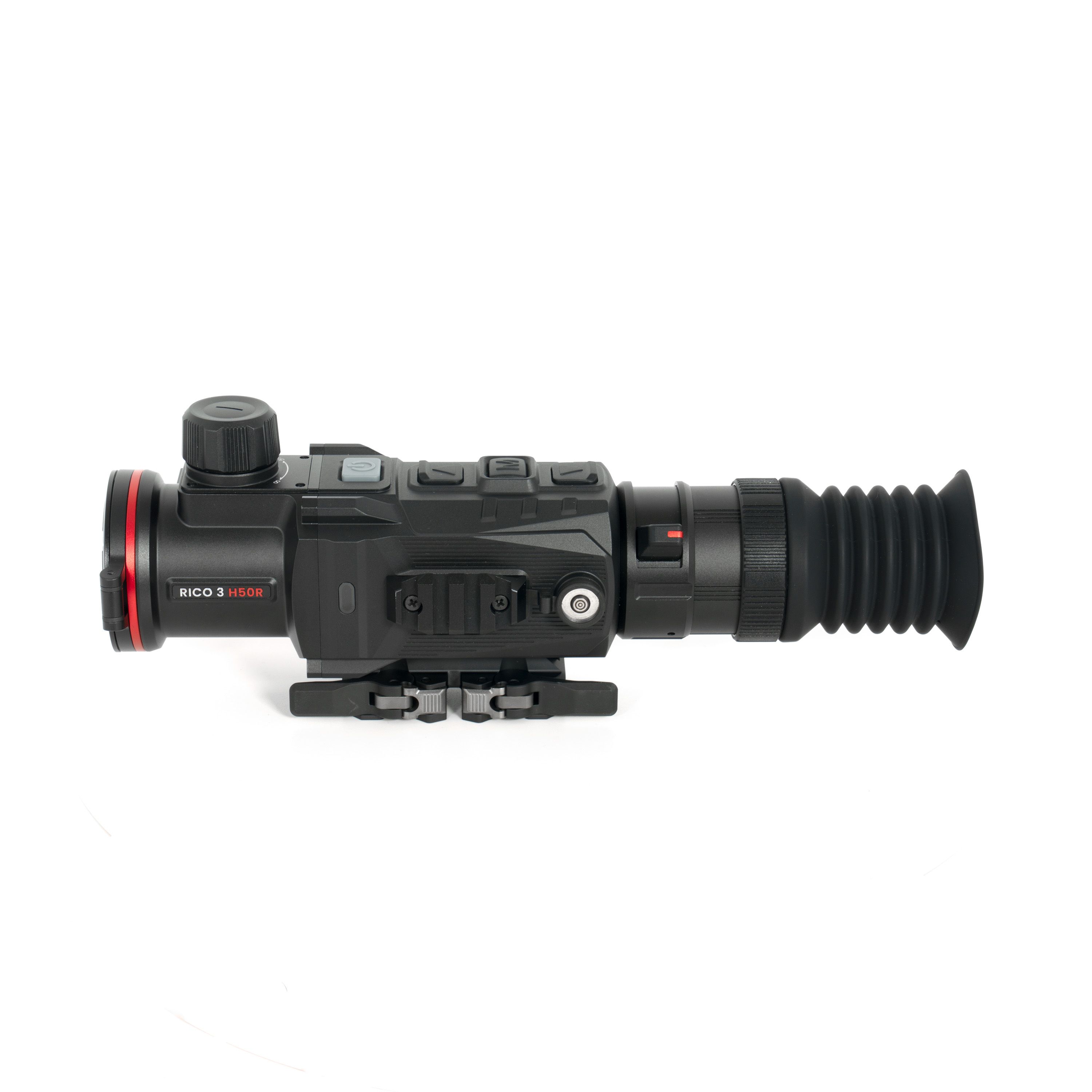 Close-up of a black professional video camera body with a large zoom lens and control dials, showing detailed gear features.