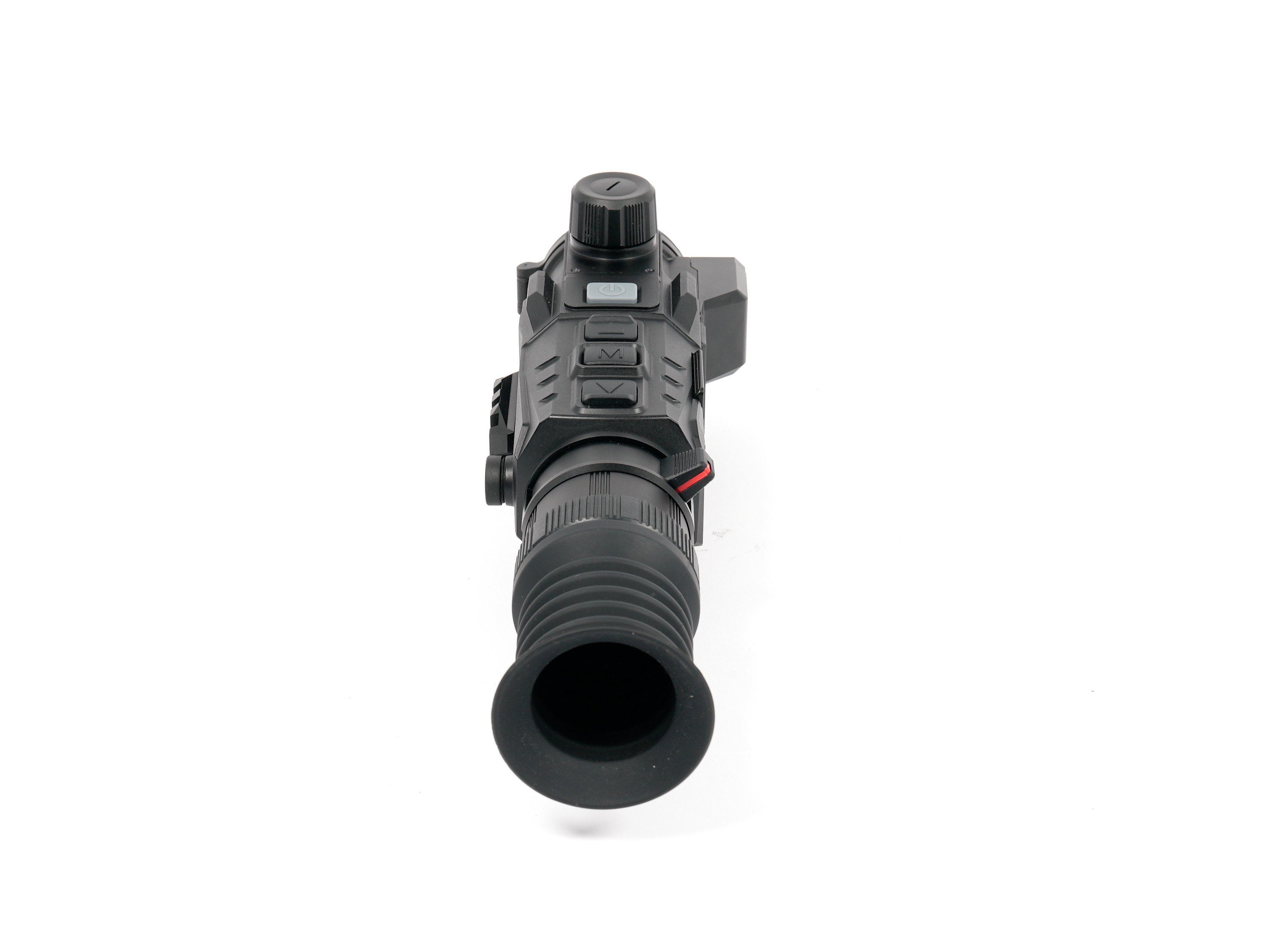 Top-down view of a black rifle scope with a large adjustment dial and side control buttons