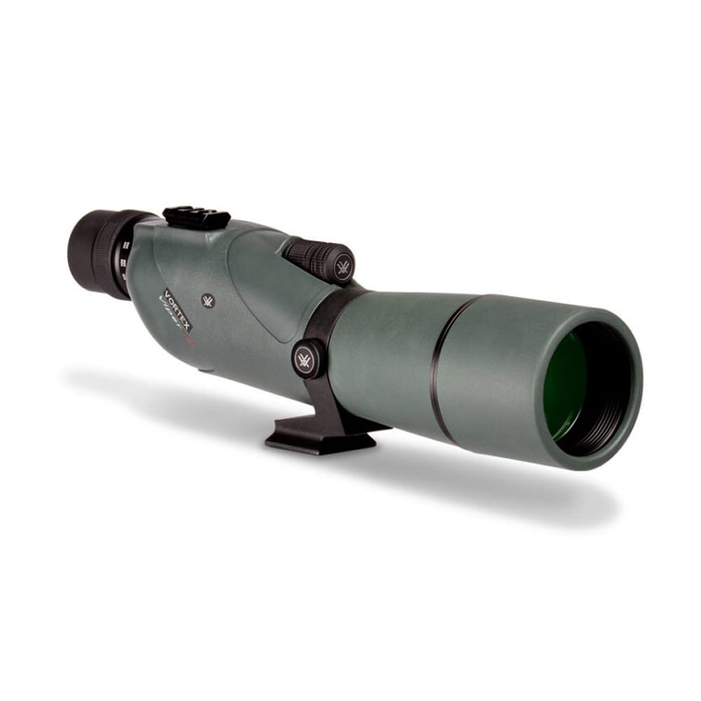 Green spotting scope with a large front lens, mounted on a small black stand, used for birdwatching or target viewing.