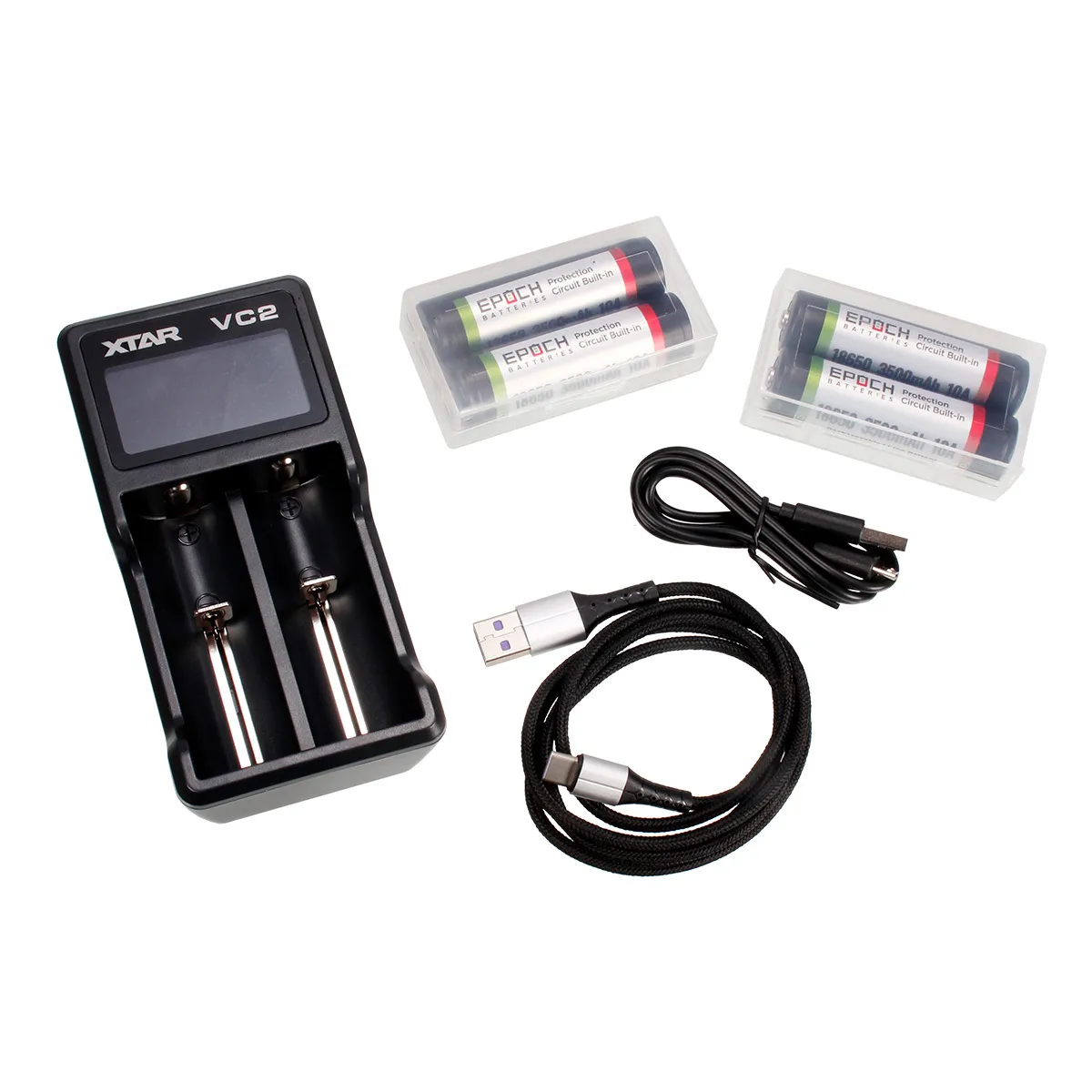 XTAR VC2 dual-bay battery charger with two AA-sized rechargeable batteries and included USB cables in a kit.