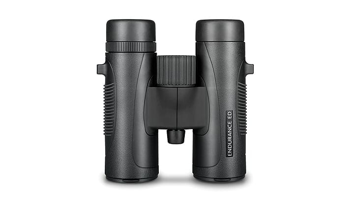 Black binoculars with a central focus wheel and rubberized grips, labeled Endurance ED on the right tube.