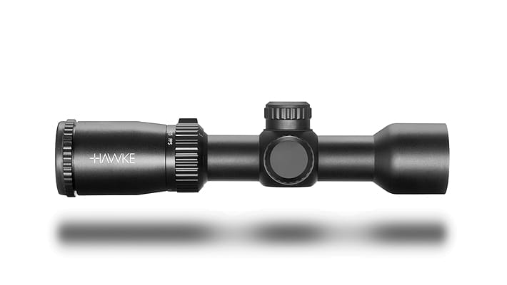 Hawke rifle scope with adjustable turrets on a white background, matte black finish.