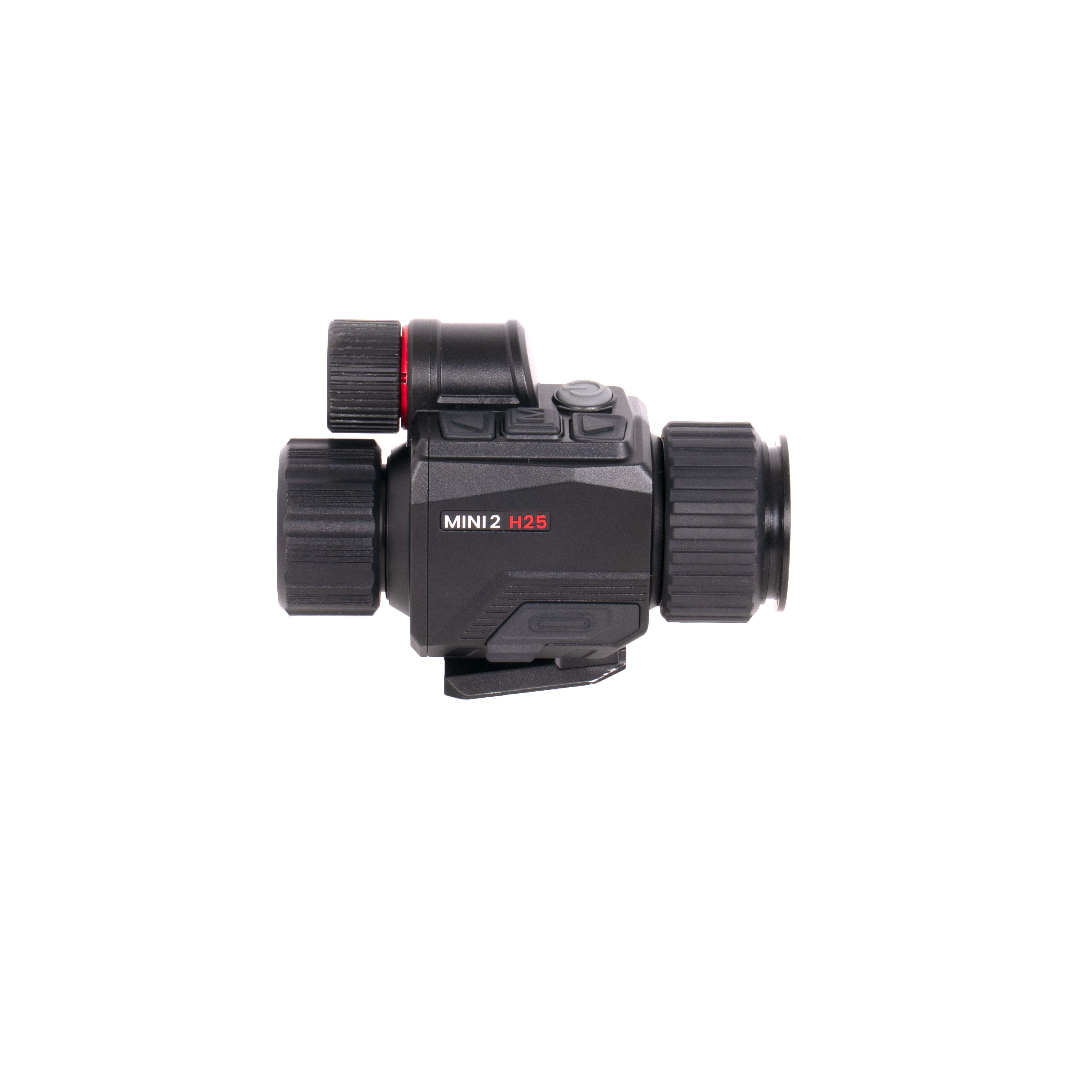 Close-up of a black rifle scope with knurled adjustment knobs and a red accent, labeled MINI 2 H25